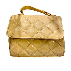 Shiny cream colored purse